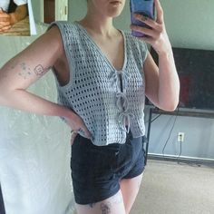 Width: 22"  Length: 17"  Acacia vest pattern by Sam Terwel. Flowy with an oversized fit. 100% cotton.  Link to pattern:  https://www.etsy.com/ca/listing/1725353904/acacia-vest-crochet-pattern-pdf-pattern?click_key=ef96b06c2460f63c9b61302606bad4204572e65c%3A1725353904&click_sum=8026be8b&ref=shop_home_recs_1&crt=1&sts=1 Tie Vest, Vest Crochet, Crochet Vest Pattern, Vest Pattern, Crochet Vest, Vest Outfits, Crochet Art, Shop Home, Womens Vest