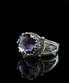 This stunning 925 sterling silver filigree art cocktail ring features a delicate lace embroidery Greek Key meander pattern and a beautiful amethyst gemstone. With a ring face of 0.47" / 12.00 mm and a 10 mm double-side faceted checkerboard round-cut amethyst, this ring is the perfect option for a wide range of occasions, including birthdays, anniversaries, Valentine's Day, Mother's Day, or just as a special gift to yourself. Crafted from high-quality sterling silver, this metal embroidery filigr Sterling Silver Purple Jewelry With Intricate Design, Sterling Silver Jewelry With Intricate Design In Purple, Purple Sterling Silver Jewelry With Intricate Design, Purple Sterling Silver Filigree Jewelry, Silver Filigree Amethyst Ring, Silver Filigree Amethyst Ring In Sterling Silver, Silver Sterling Silver Amethyst Ring With Filigree, Classic Handmade Amethyst Jewelry, Victorian Style Purple Amethyst Ring For Gift