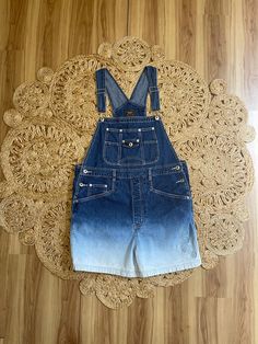 "Awesome pair of Y2K denim ombré shortalls overalls. Cute embroidered floral detail. Marked a size Large. Metal buttons at the hips. Adjustable straps. Pockets in the back. Classic and timeless style. So cute. By Route 66.  In good vintage condition.  Measurements taken while item was laying flat.  Bust: Can vary a bit due to the overall style.  Waist: 20\" Hips: 22\" Length: 33.5\" Can be made shorter or longer." Blue Bib Front Shortalls For Summer, Medium Wash Short Length Cotton Overalls, Short Cotton Overalls With Pockets, Denim Blue Shortalls, Cotton Overalls With Pockets In Short Length, Cotton Short Overalls With Pockets, Blue Cotton Shortalls, Spring Shortalls In Dark Wash, Light Wash Bib Front Overalls For Summer