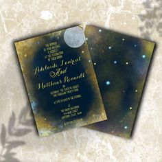 two wedding cards with the moon and stars in the night sky on top of them