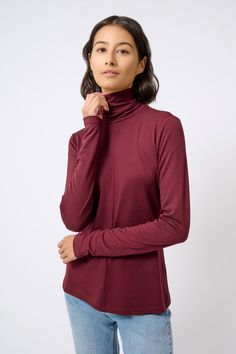 For all you non-wool lovers, we found the finest of Italian brushed jerseys to create this new essential for your Fall wardrobe. With a center front and center back seam, this style has a long turtleneck and long sleeve for extra gathering, the perfect Length for easy layering, and soft hand finish to make it your favorite.ESTIMATED DELIVERY 8/15/22 Center front and center back seams, long turtleneck with clean finish, longer sleeve length. - 83% Polyester, 14% Viscose, 3% Elastin - Fabric woven Winter Funnel Neck Turtleneck With Thumbholes, Winter Turtleneck With Thumbholes And Funnel Neck, Winter Long Sleeve Sweater With Thumbholes, Winter Sweater With Thumbholes And Long Sleeves, Classic Long Sleeve Fall Turtleneck, Classic Long Sleeve Turtleneck For Fall, Long Sleeve Sweater With Thumbholes For Fall, Solid Color Long Sleeve Top With Thumbholes For Fall, Winter Long Sleeve Top With Thumbholes For Layering