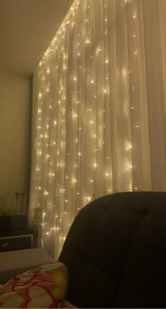 the lights are hanging on the curtain in the room, and it looks like they have been