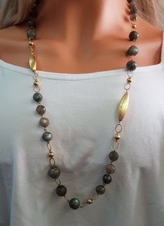 "Long elegant Mother of the Bride Necklace, Labradorite gemstones wedding Jewelry for Mother of the brides who want to wear a special piece of jewelry on their wedding special day. With gold filled and Labradorite beads, this handmade piece of jewelry will undoubtedly compliment your woman The Labradorite in this necklace are fine quality and they have excellent faceting and clarity, they really sparkle when the light shines on them. Product details : * Handmade * Labradorite Gemstones - can be Yellow Gold Single Strand Necklace For Wedding, Single Strand Long Necklace For Wedding, Gold Long Beaded Necklaces With Stones, Gold Beaded Necklace With Labradorite Stones, Gold Necklaces With Round Stone Beads, Gold Bridal Necklace Gift With Stones, Gold Bridal Necklace With Stones As A Gift, Wedding Jewelry With Natural Round Beads, Gold Labradorite Gemstone Beaded Necklace