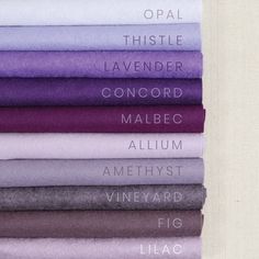 a stack of different colored sheets sitting on top of each other