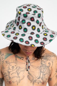 Description: Stay cool and stylish during those summer reggae music concerts or festivals with this Rasta Vinyl Records Boonie Hat! This multifunctional hat is perfect for any outdoor activities – from hikes to beach trips and even music festivals. The classic boonie-style shape with its wide brim provides great protection against the sun and offers a stylish edge to any outfit. Made from 100% cotton canvas, this adjustable hat comes with a drawstring and chin strap to ensure the perfect fit. Fe Fun Wide Brim Sun Hat For Outdoors, Black Bucket Hat For Summer Outdoor Activities, Black Summer Bucket Hat For Outdoor Activities, Summer Black Bucket Hat For Outdoor Activities, Summer Streetwear Sun Hat With Curved Brim, Curved Brim Sun Hat For Summer Streetwear, Wide Brim Sun Hat For Summer Streetwear, Fun Sun Hat For Summer Outdoor, Fun Summer Sun Hat For Outdoor