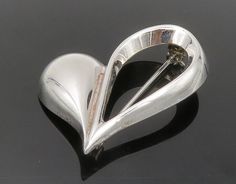 "BEAU 925 Sterling Silver - Vintage Shiny Open Love Heart Brooch Pin - BP4819  BEAU 925 Sterling Silver - Vintage Shiny Open Love Heart Brooch Pin - BP4819  Jewelry Type:         Brooch Pin   Metal Type:            925 Silver  Metal Size:             1.5\"  Stone Type:            N/A  Condition:              N/A  Jewelry Weight:     3.3 Grams  PLEASE NOTE: THIS ITEM IS PRE-OWNED. ALTHOUGH MOST ITEMS ARE IN VERY GOOD CONDITION, SOME MAY NEED CLEANING AND/OR MINOR REPAIRS. WE MAKE A VERY STRONG EFFORT TO UPLOAD CLEAR PICTURES. PLEASE INSPECT ALL PICTURES AND ASK ALL QUESTIONS YOU MAY HAVE PRIOR TO MAKING A PURCHASE. NOT ALL STONES ARE GENUINE, SOME ARE ENHANCED OR CREATED." Elegant Silver Heart Brooches, Elegant Silver Heart Brooch, Elegant Silver Heart-shaped Brooches, Elegant Silver Heart-shaped Brooch, Valentine's Day Silver Heart Brooch, Silver Heart Brooch For Valentine's Day, Silver Heart-shaped Brooch For Valentine's Day, Silver Brooches For Anniversary On Valentine's Day, Heart Brooch