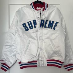 Supreme Bomber Jacket Size Medium Never Been Worn Mint Condition White Winter Outerwear For Streetwear, Winter White Varsity Jacket With Ribbed Cuffs, White Hooded Varsity Jacket For Fall, White Outerwear With Ribbed Cuffs For Fall, White Ribbed Cuffs Fall Outerwear, White Varsity Jacket For College In Fall, White Hooded Varsity Jacket With Ribbed Cuffs, White Long Sleeve Varsity Jacket For Fall, Casual White Varsity Jacket For Winter