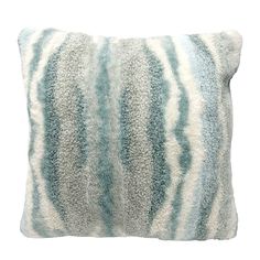 a blue and white pillow on a white background