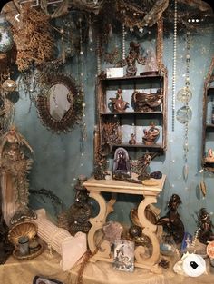 a room filled with lots of different types of ornaments and mirrors on the wall above it