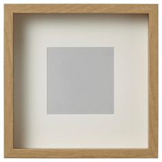 a white square in a wooden frame