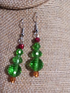 Beaded Christmas Tree earrings.  Approximately 1 1/2 inches in length.  Great small gift or stocking stuffer. Beaded Christmas Tree Earrings, Beaded Christmas Tree, Small Christmas Gifts, Tree Earrings, Christmas Tree Earrings, Earring Tree, Small Gift, Stocking Stuffer, Cross Stitch Embroidery