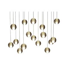 a bunch of balls that are hanging from a ceiling fixture with some lights on them