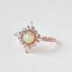 Felicegals Natural Opal Engagement Ring Cluster Halo Antique Milgrain Ring Marquise Moissanite Peekaboo Cathedral Ring14k solid rose gold band5mm Natural Cabochon OpalColourless Moissanite AccentsThe moissanite accents version features VS t... 14k Rose Gold Round Jewelry With Halo Setting, 14k Rose Gold Jewelry With Halo Setting, Fine Jewelry In 14k Rose Gold With Halo Design, 14k Rose Gold Round Halo Jewelry, Rose Gold Opal Diamond Ring In Fine Jewelry Style, Rose Gold Diamond Opal Ring Fine Jewelry, Rose Gold Opal Diamond Ring Fine Jewelry, Rose Gold Opal Diamond Ring, Fine Jewelry Rose Gold Round Cut Opal Ring