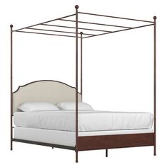 the canopy bed is made up and ready to be used as a nightstand or headboard