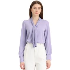 It features a classic design with a tie and long sleeves with button cuffs, creating a fitted silhouette, especially for work or office. Designed in a fluid, flowing fabric that drapes beautifully around the body. Offering effortless style, the blouse falls beautifully on the body and features a subtly pleated design to add to the delicate nature. A tie front design creates a feminine finish on this shirt, an everyday staple for the office. Style it with your favorite jeans and heels for a styli Solid Long Sleeve Shirt For Office, Fitted Long Sleeve Professional Blouse, Elegant Tie Neck Shirt For Workwear, Professional Long Sleeve Fitted Blouse, Casual Solid Color Blouse For Business, Classic Tie Neck Blouse, Casual Business Blouse, Long Sleeve Solid Blouse For Business, Long Sleeve Blouse For Business