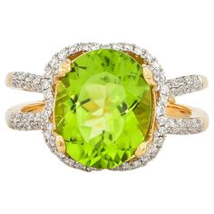 This collection features an array of pretty peridot rings! Accented with diamonds these rings are made in yellow gold and present a vibrant and fresh look. Classic peridot ring in 18K yellow gold with diamonds. Peridot: 4.5 carat oval shape. Diamonds: 0.519 carat, G colour, VS clarity. Gold: 5.44g, 18K yellow gold. Ring Size: US 6.75 - Size can be adjusted for free upon request - please reconfirm with your order. R540 Luxury Brilliant Cut Peridot Jewelry, Unique Luxury Peridot Rings, Luxury Peridot Three Stone Rings, Luxury Elegant Peridot Rings, Luxury Peridot Gemstone Ring, Peridot Rings, 5 Carat Ring, Dream Engagement, Dream Engagement Rings