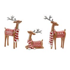 three wooden reindeer figurines with red and white sweaters