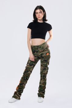 Details Fit: Nova - High Rise, Stacked Fit Color: Wood Camo Material: 97% Cotton / 3% Spandex Style: AP24520EC Military Style Fitted Bottoms For Streetwear, Fitted Military Style Bottoms For Streetwear, Fitted Military Style Pants For Streetwear, Fitted Camouflage Military Pants, Fitted Camouflage Bottoms For Fall, Fitted Camouflage Cargo Pants For Streetwear, Fitted Military Cargo Pants For Fall, Fitted Camouflage Bottoms With Cargo Pockets, Fitted Camouflage Pants With Cargo Pockets