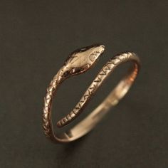 This Solid 14K Gold snake ring will surely become one of your favorite accessories! Inherently stylish, this ring is hand cast in our studio in your choice of solid 14K gold: Rose, White or Yellow. Your ring will be made to size just for you, but is also adjustable for any occasion or weather. The snake measures approximately 2mm wide by 1.5mm thick (varying along his length). And his head measures 4mm wide by about 8mm long. He coils effortlessly around your finger for a unique accessory that w Adjustable Snake Ring In Yellow Gold, Symbolic Adjustable Snake Ring Gift, Adjustable Symbolic Snake Ring Gift, Adjustable Yellow Gold Snake-shaped Ring, Unique Adjustable Snake Ring For Anniversary, Adjustable Yellow Gold Snake Ring, Adjustable Unique Yellow Gold Snake Ring, Adjustable 14k Gold Snake Ring, Adjustable 14k Gold Snake Ring For Anniversary