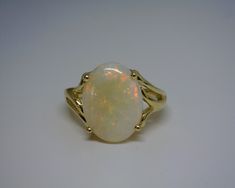 an opalite ring is shown on a white surface