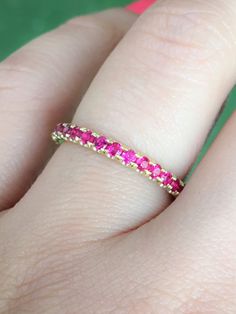 "Half Eternity Band Ring with Micro Pave Set Natural Ruby. MaterialSolid Gold (14K/18K) or Platinum 950 FinishHigh Polished/Shiny FitComfort/Rounded Interior Width2.5 mm Height2.5 mm Weightapx. 4gr. SettingU Micro Pave (Reminds the letter \"U\" from the sides) StoneNatural Ruby Cut & ShapeDiamond Cut, Round Stone Size2mm Total Carat Weight....apx 0.65 carat Quantity of Stones...apx 16+ stones (varies by size) QualityAAA Click below to add laser engraving. https://www.etsy.com/listing/6310709 Ruby Eternity Band In Yellow Gold Stackable, Stackable Ruby Eternity Band In Yellow Gold, Yellow Gold Ruby Eternity Band Stackable, Yellow Gold Ruby Round Cut Eternity Band, Classic Ruby Eternity Band For Wedding, Yellow Gold Ruby Eternity Band, Elegant Red Ruby Eternity Band, Stackable Ruby Eternity Band With Round Cut, Stackable Round Cut Ruby Eternity Band