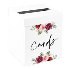 a white box with flowers and the word cards on it's front, in black lettering