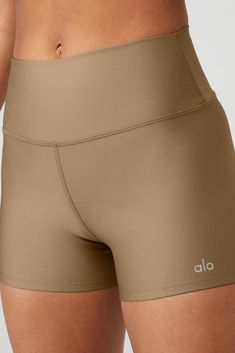 This essential yoga short with a high-waist fit and breathable micro-performance fabric lifts, sculpts, and contours, so you can flow through hot yoga or hit the streets in style. Engineered with Airlift's signature smoothing technology, it keeps you cool and comfortable during challenging flows while highlighting your best assets. Designed to flatter every size, you'll love the super-smooth fit with a second-skin feel that's sure to get noticed both on and off the mat. Whether you're just start Versatile Micro-elastic Bottoms By Alo Yoga, Alo Yoga Stretch Athleisure Athletic Shorts, Alo Yoga Sports Bottoms, Solid Bottoms With Built-in Padding For Pilates, Bottoms With Built-in Padding For Pilates, Alo Yoga Stretch Athletic Shorts For Workout, Alo Yoga Compressive Functional Bottoms, Functional Compressive Alo Yoga Bottoms, Sleek Solid Color Activewear