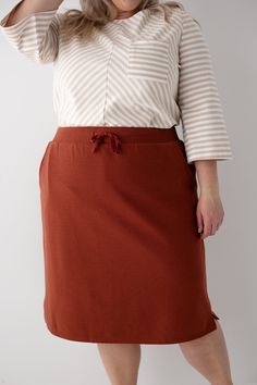 Meet the 'Lauren' Everyday Knit Skirt, the ultimate blend of comfort and style! Designed with soft, high-quality knit fabric, this skirt is your next go-to piece for everyday wear – perfect for running errands, meeting friends for coffee, or simply lounging at home. For a casual daytime look, pair this skirt with a simple tee and sneakers! Exclusively designed by us with you in mind. Taupe 48% Cotton 48% Polyester 4% Spandex Rust 60% Cotton 40% Polyester Hand Wash Cold Do Not Bleach Hang to Dry Low Iron if Needed Do Not Dry Clean Fully Lined 2" Side Slits Model in Rust Height 5'9" | Wearing Size Small Model in Rust Height 5'8" | Wearing Size 1X Model in Taupe Height 5'5" | Wearing Size Small Please carefully measure a similar item before placing your order to allow for the best fit and als Everyday Fall Lined Skirt, Relaxed Midi Skirt For Loungewear, Relaxed Lined Skirt For Loungewear, Relaxed Fit Midi Skirt For Loungewear, Relaxed Loungewear Skirt With Elastic Waistband, Solid Color Relaxed Fit Skirt For Fall, Solid Relaxed Fit Skirt For Fall, Knee-length Relaxed Skirt For Loungewear, Everyday Cotton Skirt For Fall