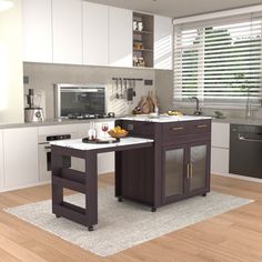 a modern kitchen with white cabinets and wood flooring, along with an island in the middle