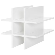 three white shelves are stacked on top of each other, one is empty and the other has