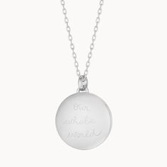 Our weighted Personalized Locket Necklace Sterling Silver can be hand-engraved on the inside and out, keeping your loved ones and special memories close to heart.925 Sterling SilverLoquet charm: 0.8 diameterSecure clasp fasteningCharms are removable from this chain and can be worn on all Merci Maman chain lengthsHand-engraved in our Paris studioSent with love in a complimentary gift boxAny slight variations in lettering depth, spacing and alignment from the examples shown are part of the aesthetic and originality of the piece Elegant Engraved Stainless Steel Charm Necklaces, Elegant Engraved Stainless Steel Charm Necklace, Silver Oval Sterling Silver Charm Necklace, Oval Silver Sterling Silver Charm Necklaces, Silver Sterling Oval Charm Necklaces, Anniversary Necklace With Sterling Silver Clasp And Round Pendant, Minimalist Silver Jewelry With Engraving Option, Classic White Gold Charm Necklaces For Anniversary, Classic White Gold Charm Necklace For Anniversary