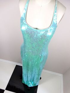 "This is a JAW-DROPPING vintage gown! It's fully embellished with iridescent sequins and in perfect condition! Measurements: Bust - 34\" Waist - 27\" Hips - 36\" Length - 59\" This item comes from a pet-free and smoke-free home. If you would like more info or have any questions, please don't hesitate to ask!" Iridescent Mermaid, Sequined Gown, Iridescent Dress, Checkered Jacket, Mermaid Sequin, Sequin Jacket, Vintage Gowns, Beaded Gown, Embellished Dress