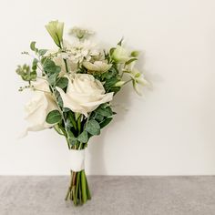 Delicate bridesmaid bouquet in all white color palette featuring roses featured in San Francisco wedding Bridesmaid Bouquet Eucalyptus White, Small Wedding Boquetes Of Flowers, Bridesmaids Holding One Flower, Single Stem Bridesmaid Bouquet, Olive Bouquet, White Bridesmaid Bouquet, Small Simple Wedding, Maid Of Honor Bouquet, Diy Bridesmaid Bouquet