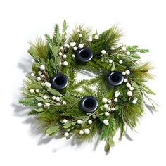 a christmas wreath with black and white decorations