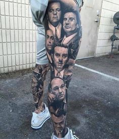 a man's leg with many faces on it