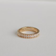 The sister of our Baguette Eternity Ring, this gem showcases marquise crystals around the entire band, bordered with a scalloped edge for comfort. Perfect layering ring for that trending chunky bold look. MATERIALS: Gold Plated, Brass Cubic Zirconia Need some jewelry inspiration? Follow us on Instagram @statementGrey Baguette Eternity Ring, Gold Eternity Band, Eternity Ring Gold, Layered Rings, Gifts For My Sister, Stackable Ring, Affordable Jewelry, Silver Pieces, Eternity Band