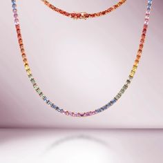 Beautiful Diamond Tennis Necklace. A staple in your jewelry collection. Handmade in New York City of polished 14k white gold. This tennis necklace showcases a delicate 4 prongs in line chain embellished with dozens of shimmering multi color sapphires ( NO Lab Made). Quality to us is important and that is why we hand se Rainbow Sapphire Jewelry, Rainbow Things, Style Theory, Sapphire Jewellery, Multi Coloured Necklaces, Diamond Tennis Necklace, Rainbow Sapphires, 14k Yellow Gold Necklace, Multi Sapphire