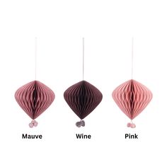 three different shades of pink, mauve, and wine hanging from the same string