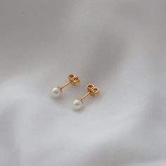 Delicate, mini pearl earrings for your everyday outfits! Cheap Minimalist Pearl Earrings With Charm, Tiny Round Elegant Earrings, Tiny Round Elegant Cartilage Earrings, Elegant Tiny Drop Earrings, Elegant Tiny Round Earrings, Elegant Tiny Earrings For Everyday, Minimalist Pearl Earrings For Everyday, Minimalist Everyday Pearl Earrings, Delicate Pearl Charm Earrings For Everyday