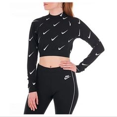 Nike Sportswear Cropped Top Size Medium Nwt! Black Long Sleeve Crop Shirt New With Tags! New Without Defects! Size Medium Measurements Are Located In Photos Black Metallic Nike Logo Throughout Soft And Stretchable Poly-Cotton Blend Fabric Nike Signature Branding Print Elastic Bottom Band Super Fast Shipping From A Smoke And Pet Free Home Feel Free To Ask Any Questions Thank You For Looking Moisture-wicking Tops For Fall, Sporty Stretch Winter Tops, Fitted Sportswear Tops For Winter, Winter Fitted Sportswear Tops, Fitted Winter Sportswear Tops, Winter Sporty Workout Tops, Winter Workout Sporty Tops, Sporty Black Stretch Top, Fitted Winter Sports Tops