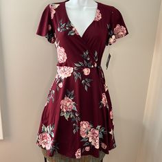 Nwt New With Tags, No Flaws Or Defects Maroon/Burgundy With Pink Floral Print V Neck, Faux Wrap Top Short, Flared Sleeves And Skirt Tie At Waist Measures 33 Inches From Shoulder To Bottom Hem 96% Polyester, 4% Spandex Casual Burgundy Short Sleeve Dress, Burgundy Floral Print Summer Dress, Casual Burgundy Dress For Date Night, Burgundy Short Sleeve Dress For Date Night, Faux Wrap Top, Pink Floral Print, Faux Wrap Dress, Wrap Top, Flared Sleeves