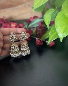 Make your self look pretty in these trendy Mehendi plated kundan  pearl jhumkas earrings The weight of the earrings is 1.4 oz. Product care: Avoid contact with Chemicals such as Perfumes or any Sprays. Prevent the Jewellery from the water. Use Butter Paper or Cotton Cloth to store your Jewelry for a longer Product life. Kundan Jhumkas, Pearl Jhumkas, Butter Paper, Jhumkas Earrings, Earrings Trendy, Jhumka Earrings, Jewelry Maker, How To Look Pretty, Chemicals