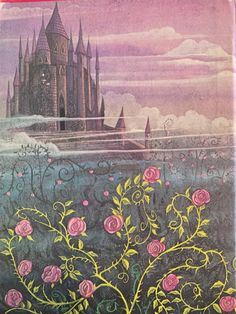 an old book with pink roses in the foreground and a castle in the background