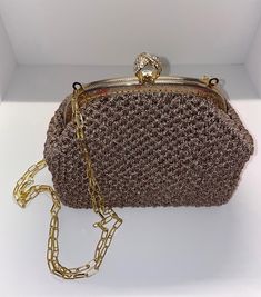 Handmade Crochet Bag with Silver Metal Chain Strap and clasp Colour: Beige Dimensions:  Bag: 22 x 11 x 18cm (height) / 8.7 x 4.3 x 7 in Chain Strap: 100cm Can be used with or without the chain Inside the bag there is a zip pocket  Worldwide tracked delivery Beige Crochet Evening Bag, Brown Party Clutch With Chain Strap, Rectangular Crochet Shoulder Bag For Party, Elegant Beige Crochet Crossbody Bag, Elegant Beige Crossbody Crochet Bag, Elegant Handmade Crochet Crossbody Bag, Chic Crochet Bag For Evening, Gold Crochet Evening Bag, Elegant Brown Crochet Shoulder Bag