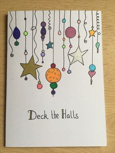 a card that says deck the hall with stars and balls hanging from it's strings