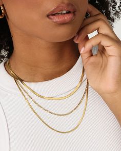 The Women's Snake and Figaro Chain Set is your all-in-one layered chain look that'll pair with your existing jewellery or on its own for a simple everyday look. This set includes two snake chains paired with one Figaro chain to give a unique layered vibe.

- 3 chains included
- One Size
- Approx. lengths: Snake chain 1: 40.1cm, Snake chain 2: 50.3cm, Figaro chain: 44.5cm
- Combined weight: 11.2g
- Lobster claw clasp
- 18k Gold plated
- Colour: Gold
- Style: RHSNANFIGCH Chain Set Gold, Layered Chain, Figaro Chains, Figaro Chain, Culture Kings, Snake Chain, Gold Style, Lobster Claw, Everyday Look