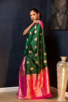 Green Katan Banarasi Silk Saree Embellished with Golden Floral Motifs and Pink Border - Anvi Couture Pink Banarasi Silk Saree, Dark Green And Pink, Gorgeous Saree, Baluchari Saree, Golden Saree, White Embroidered Blouse, Sequin Saree, Orange Saree, Cotton Gowns