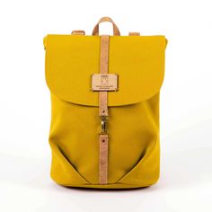 "Introducing our Eco-conscious Yellow Backpack for Women, the ultimate blend of style, sustainability, and functionality. Designed with the environmentally aware individual in mind, this sustainable rucksack is perfect for the eco-conscious woman who seeks fashion with a purpose. Crafted from upcycled ocher material, this backpack showcases a commitment to both style and the environment. The bold yellow color adds a vibrant touch to your everyday adventures. This versatile bag is ideal for the a Functional Yellow Backpack For Everyday, Yellow Backpack For Everyday Use, Everyday Yellow Rectangular Backpack, Everyday Rectangular Yellow Backpack, Functional Yellow Backpack With Adjustable Strap, Eco-friendly Satchel Bucket Bag With Adjustable Strap, Eco-friendly Handmade Everyday Backpack, Eco-friendly Yellow Everyday Bag, Eco-friendly Yellow Travel Bags