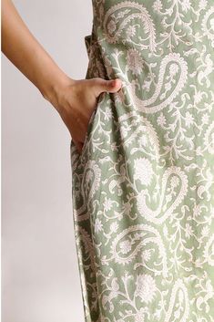 The Alicia shirt midi dress is a springtime staple. Crafted with care from cotton, its charming block print adds flair to its warm green shade. Featuring a collared design and front button closure, this jade short-sleeve maxi dress exudes casual elegance. With two handy pockets, it's as practical as it is stylish, making it perfect for effortless chic on sunny days.Material: Cambric - 100% cottonStyle/Print: Hand Block PrintNumber of Pockets: 2Length: 45 inchesOccasion: CasualColor: Jade Spring Block Print Dresses With Relaxed Fit, Spring Block Print Relaxed Fit Dresses, Spring Daywear Dresses With Block Print, Fitted Modest Cotton Maxi Dress, Green Relaxed Fit Midi Dress For Daywear, Modest Green Spring Maxi Dress, Cotton Short Sleeve Maxi Dress For Spring, Green Relaxed Fit Maxi Dress With Short Sleeves, Green Cotton Midi Dress For Daywear