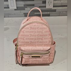 Juicy Couture Rosie Backpack Blush Pink, Macroon Dot Adjustable Straps Gold Colored Zippers On Exterior And Interior Logo Lined Interior Side Slip Pockets Perfect For Yourself Or As A Gift! See Photos For Details And Condition Open To Offers And Bundles Check Out My Other Listings For Additional Items Cute Pink Bag With Zipper Pocket, Casual Pink Crossbody Backpack, Trendy Pink Backpack With Zipper Pocket, Trendy Pink Satchel Backpack, Chic Pink Backpack With Adjustable Strap, Trendy Backpack With Removable Pouch For Shopping, Chic Everyday Pink Backpack, Luxury Pink Standard Backpack, Pink Zipper Closure Standard Backpack